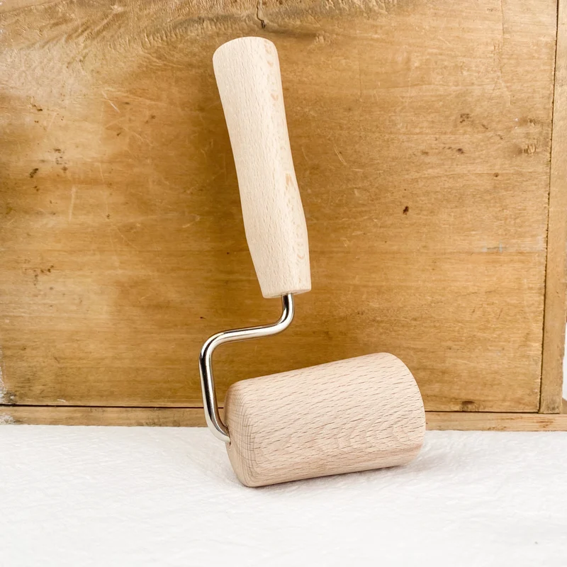 Rouleau conique à étaler la pâte